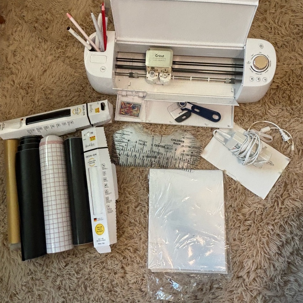 Cricut cutting machine with vinyl and tools
